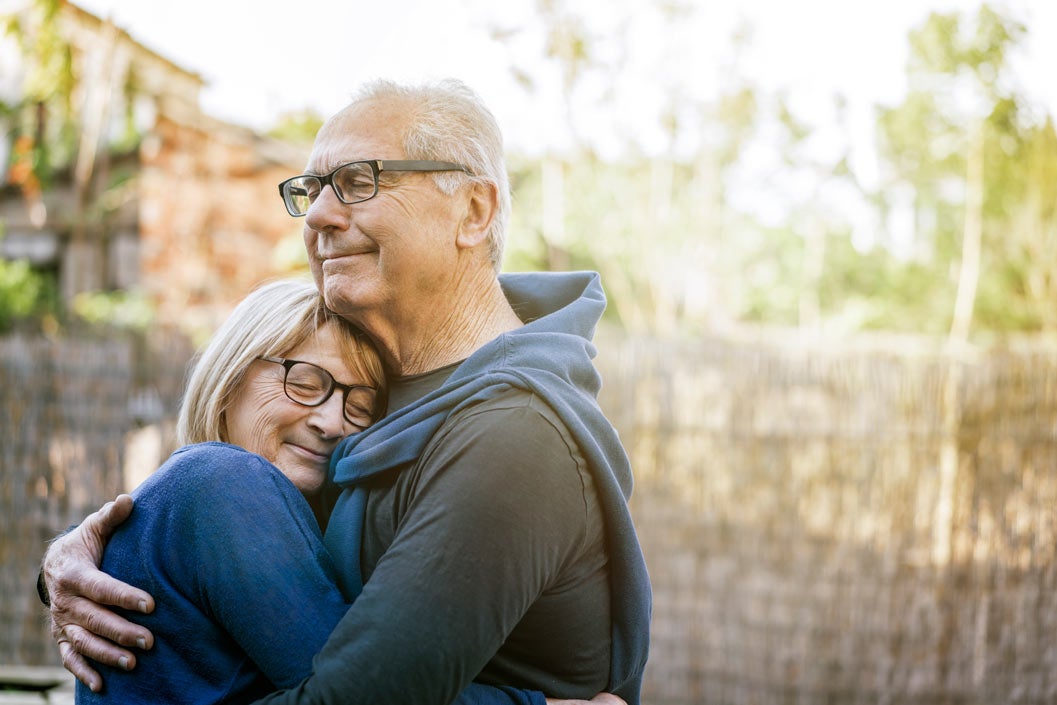 Mature couple hugging outdoors