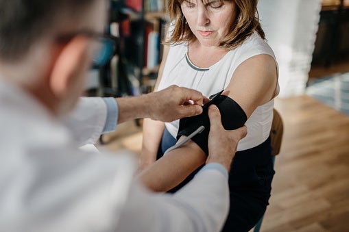 Woman getting her blood pressure checked